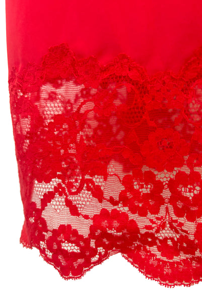 Skirt detail view of 1950s vintage crimson red nylon and lace full slip by Van Raalte, small to medium. Showing the floral lace at the hem.