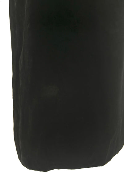 Skirt detail view of 1950s vintage black silk satin and velvet wiggle cocktail dress, by Nathan Strong, extra small to small. Showing a lighter spot on the skirt.
