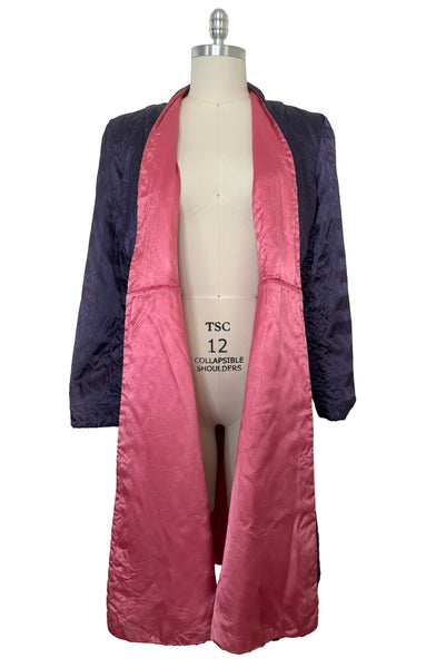 Open front view of 1940s purple satin quilted robe with pink satin lining by Sandora, medium to large.
