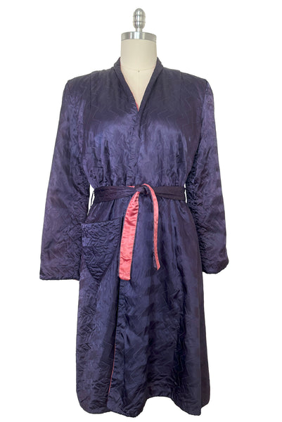 Front view of 1940s purple satin quilted robe with pink satin lining by Sandora, medium to large.