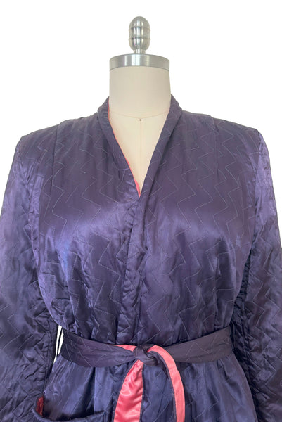 Bodice front view of 1940s purple satin quilted robe with pink satin lining by Sandora, medium to large.
