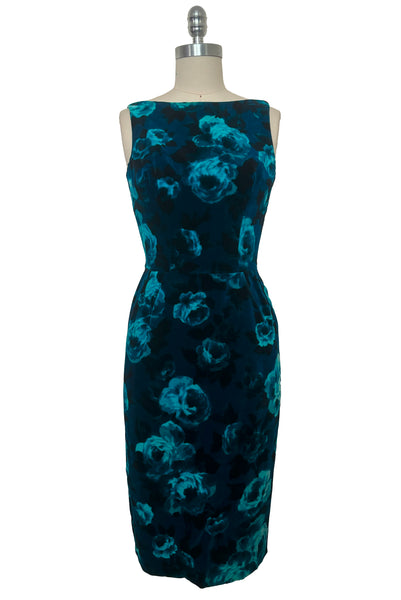 Dress front view of 1950s vintage teal and turquoise blue floral velvet dress and jacket set by Lillie Rubin, size extra small to small. Showing the boat neck, sleeveless sheath silhouette with pencil skirt.