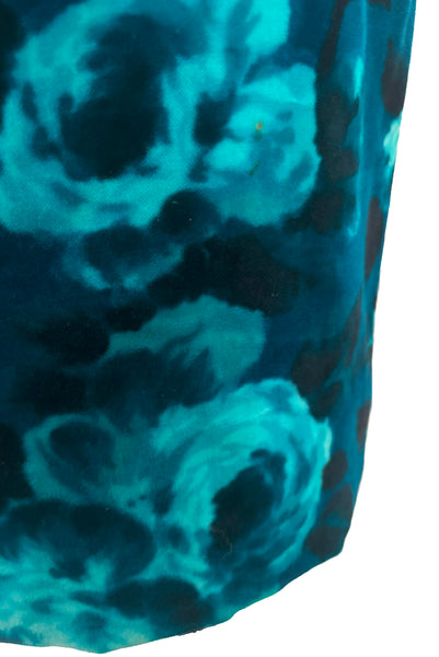 Detail view of 1950s vintage teal and turquoise blue floral velvet dress and jacket set by Lillie Rubin, size extra small to small. Showing staining on the skirt.