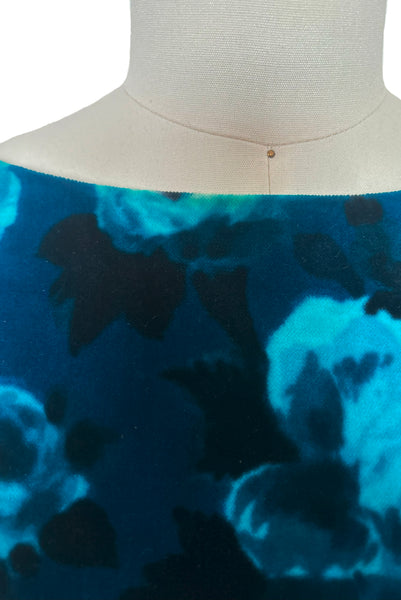 Detail view of 1950s vintage teal and turquoise blue floral velvet dress and jacket set by Lillie Rubin, size extra small to small. Showing light discoloration at the dress neckline.