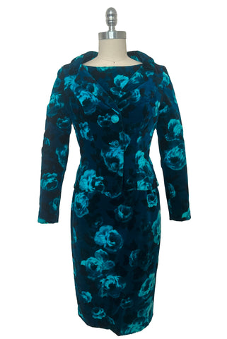 Front view of 1950s vintage teal and turquoise blue floral velvet dress and jacket set by Lillie Rubin, size extra small to small. Showing the standing collar, self fabric covered buttons, long sleeves, and slim pencil silhouette.