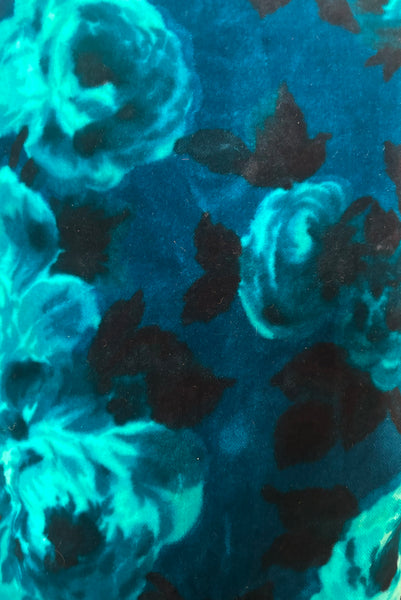 Detail view of 1950s vintage teal and turquoise blue floral velvet dress and jacket set by Lillie Rubin, size extra small to small. Showing staining on the skirt.