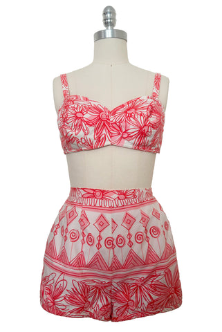 Front view of 1950s vintage coral pink & white sketchy geometric floral print high waist two piece playsuit/swimsuit by Roxanne for Perfection Fit, size extra small to small.