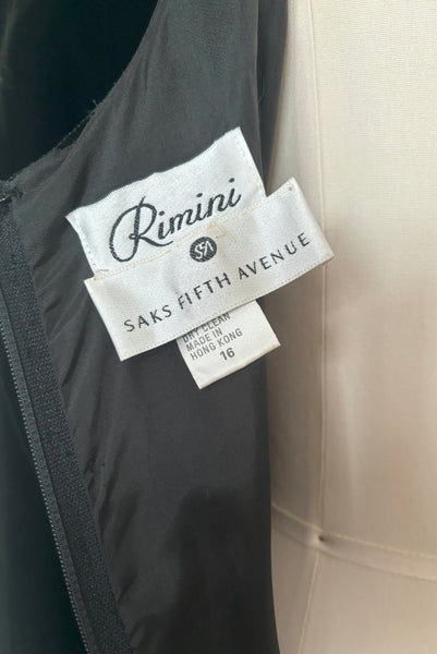 Interior detail view of 1990s vintage black velvet and olive green taffeta cocktail dress by Rimini, size medium to large. Showing the Rimini and Saks Fifth Avenue labels, and size 16 tag.