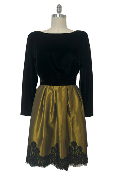 Front view of 1990s vintage black velvet and olive green taffeta cocktail dress by Rimini, size medium to large.