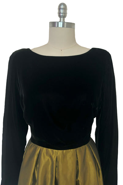 Bodice front view of 1990s vintage black velvet and olive green taffeta cocktail dress by Rimini, size medium to large.