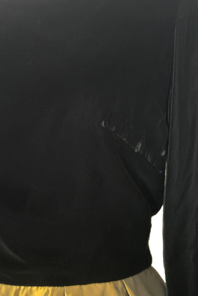 Detail view of 1990s vintage black velvet and olive green taffeta cocktail dress by Rimini, size medium to large. Showing some pressed nap around the bust darts.