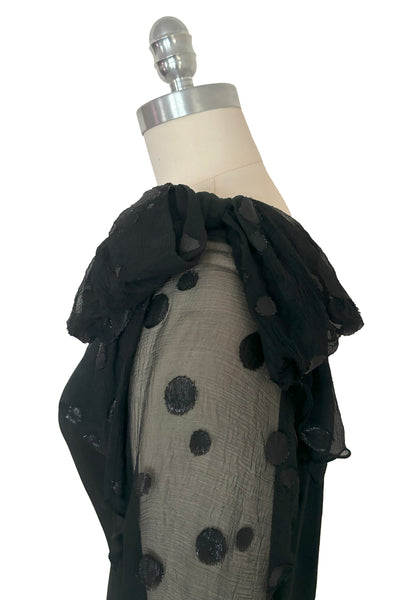 Detail view of 1990s vintage black polka dot silk chiffon and crepe asymmetrical dress by Giorgio Beverly Hills, size small to medium. Showing the sheer one shoulder design with shoulder bow.