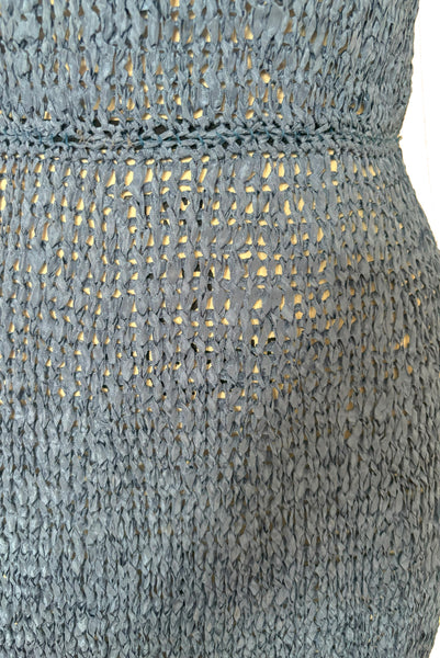 Detail view of 1950s vintage periwinkle rayon ribbon crochet dress, medium to extra large. Showing the crochet pattern in the ribbon and elastic waist.