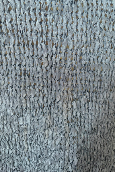Detail view of 1950s vintage periwinkle rayon ribbon crochet dress, medium to extra large. Showing a very light spot on the skirt back.