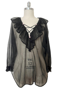 Front view of 1960s vintage sheer black nylon lace trimmed lingerie poet's blouse by Alana Gale Intimates, size medium to large.