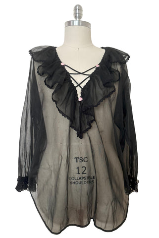 Front view of 1960s vintage sheer black nylon lace trimmed lingerie poet's blouse by Alana Gale Intimates, size medium to large.