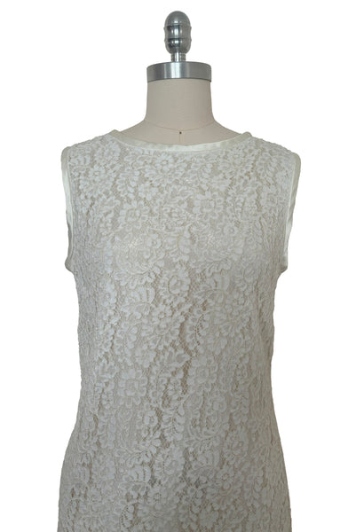 Bodice front view of 1960s vintage white corded lace sleeveless sheath dress by Jonathan Logan, size small to medium. Showing the white satin binding at the neck and armholes.