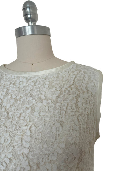 Detail view of 1960s vintage white corded lace sleeveless sheath dress by Jonathan Logan, size small to medium. Showing the satin binding at the neck and armholes, and a close-up of the corded lace.