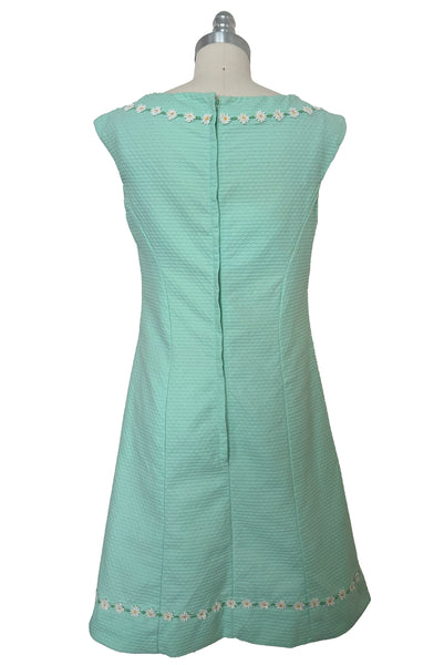 Back view of 1960s vintage mint green cotton pique daisy trimmed sheath dress, size extra small to small.