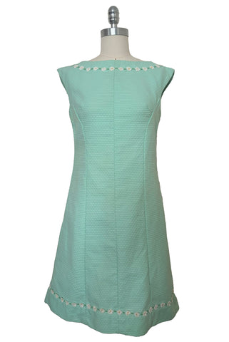 Front view of 1960s vintage mint green cotton pique daisy trimmed sheath dress, size extra small to small.