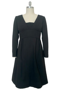 Front view of 1960s vintage Mod crepe empire waist little black dress, by Teal Traina, size small to medium.