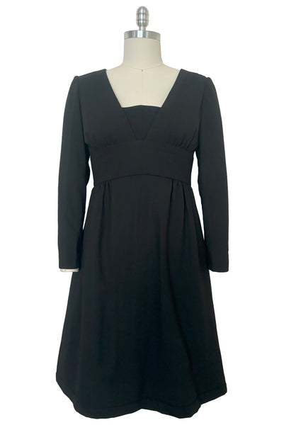 Front view of 1960s vintage Mod crepe empire waist little black dress, by Teal Traina, size small to medium.