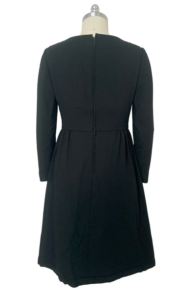 Back view of 1960s vintage Mod crepe empire waist little black dress, by Teal Traina, size small to medium.