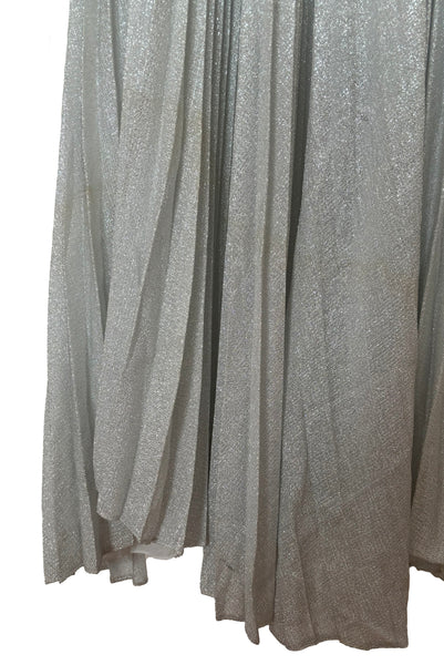 Skirt detail view of 1960s silver Lurex and white beaded evening gown by Mignon, medium to large. Showing discoloration near the hem of the pleated skirt.