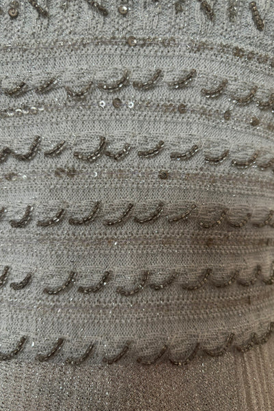 Bodice waist front detail view of 1960s silver Lurex and white beaded evening gown by Mignon, medium to large. Showing some areas of loosened beading and sequins that have lost their silver color.