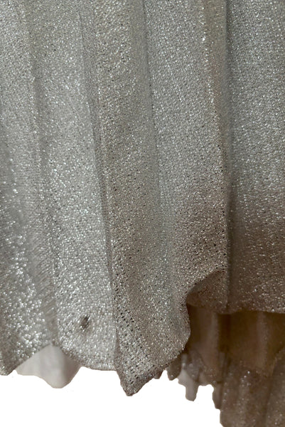 Skirt detail view of 1960s silver Lurex and white beaded evening gown by Mignon, medium to large. Showing the beaded and sequined halter neckline. Showing damage to the skirt.