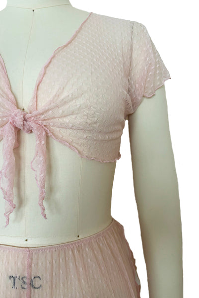 Detail view of 1990s vintage pale pink mesh tie pajama top and pants lingerie set, size small, medium, large.