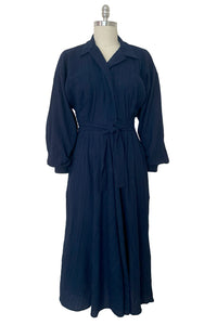 Front view of 1980s vintage bright navy blue long sleeve midi shirtdress by Norma Kamali, size small to medium.
