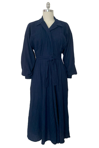 Front view of 1980s vintage bright navy blue long sleeve midi shirtdress by Norma Kamali, size small to medium.