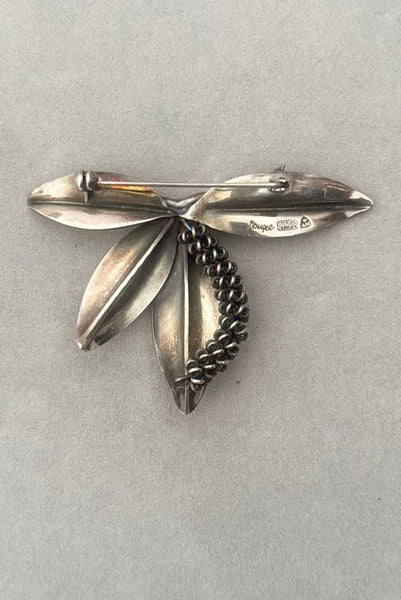 Vertical back view of 1950s vintage Gertrud Engel 925 sterling silver Danish modernist botanical leaf brooch for Anton Michelsen, made in Denmark.