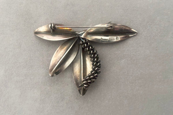 Horizontal back view of 1950s vintage Gertrud Engel 925 sterling silver Danish modernist botanical leaf brooch for Anton Michelsen, made in Denmark.