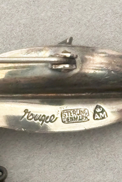 Detail view of 1950s vintage Gertrud Engel 925 sterling silver Danish modernist botanical leaf brooch for Anton Michelsen, made in Denmark. Showing a close-up of the sterling Denmark and AM stamps.