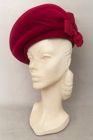 Vertical 3/4 view of 1950s vintage dark pink velvet oversized beret hat, by Evelyn Varon.