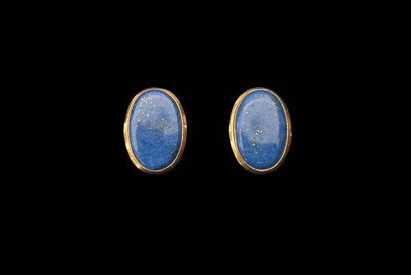 Horizontal front view of 1980s vintage 10kt gold and blue lapis lazuli oval stud earrings.
