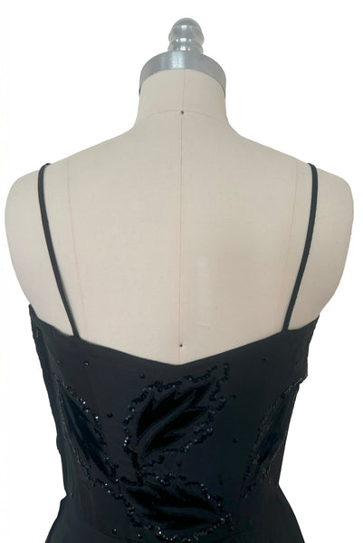 Bodice back view of 1950s vintage black taffeta sequin applique cocktail dress embellished with black velvet roses, size extra extra small to extra small.