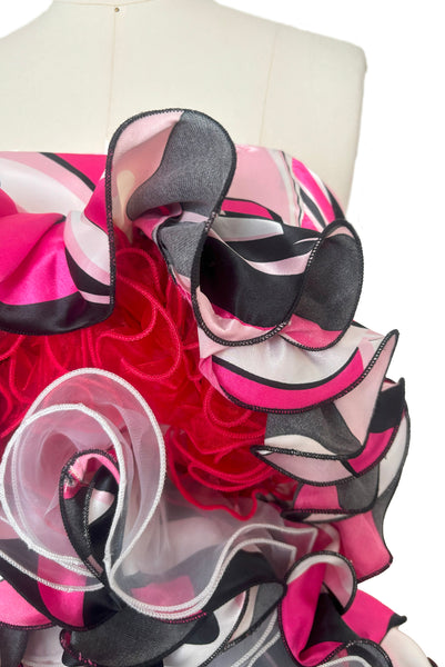 Bodice front detail view of 2000s y2k vintage pink, black, white, and red psychedelic satin strapless ruffled prom or quinceañera gown with train, extra small to small. Showing the self fabric, red and white organza ruffled satin bodice.