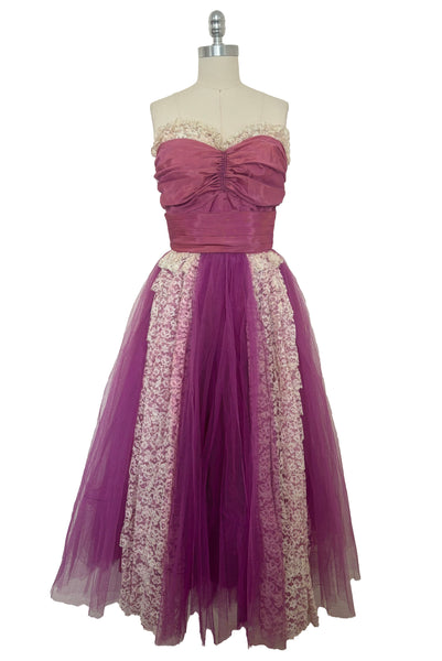 Front view of as is 1950s vintage purple tulle and cream lace strapless ruffled evening dress, size extra small to small.