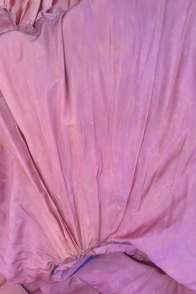 Interior detail view of as is 1950s vintage purple tulle and cream lace strapless ruffled evening dress, size extra small to small. Showing extensive discoloration to the acetate.