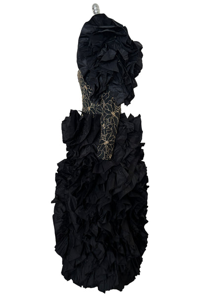 Side view of 1980s vintage black & gold floral embroidered one shoulder ruffled silk evening dress, size extra small to small.
