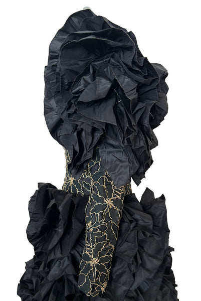 Bodice side view of 1980s vintage black & gold floral embroidered one shoulder ruffled silk evening dress, size extra small to small. Showing the gold floral embroidered ruffled one shoulder bodice with dropped waist.