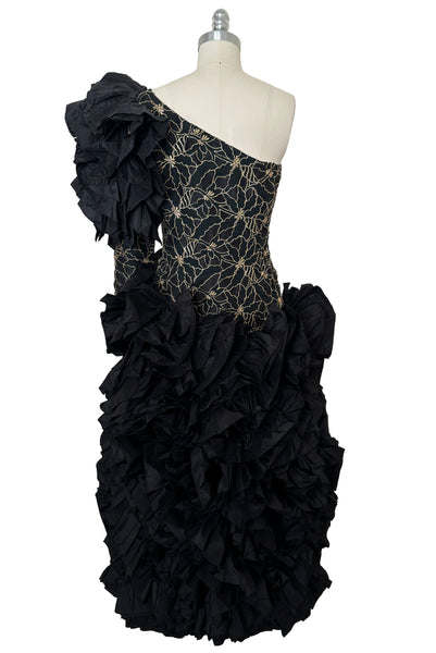 Back view of 1980s vintage black & gold floral embroidered one shoulder ruffled silk evening dress, size extra small to small.