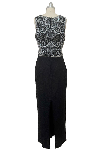 Back view of 1980s vintage Art Deco faux pearl, silver and black glass beaded black silk chiffon evening dress, size small to medium. With a scoop neckline, sleeveless bodice, and floor length pencil skirt.