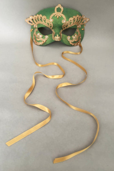 Vertical front view of 1990s gold Lurex lace, gold Swarovski crystal, and metallic green painted half mask with gold satin ribbon ties. Showing the gold satin ribbon ties.