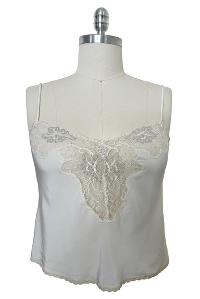 Front view of 1970s vintage white polyester challis and floral lace faux pearl embellished lingerie camisole top by Christian Dior, size small to medium.
