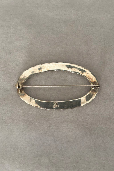 Vertical back view of 1980s vintage 925 sterling silver twisted rope design oval brooch/pin by Nida Factory.