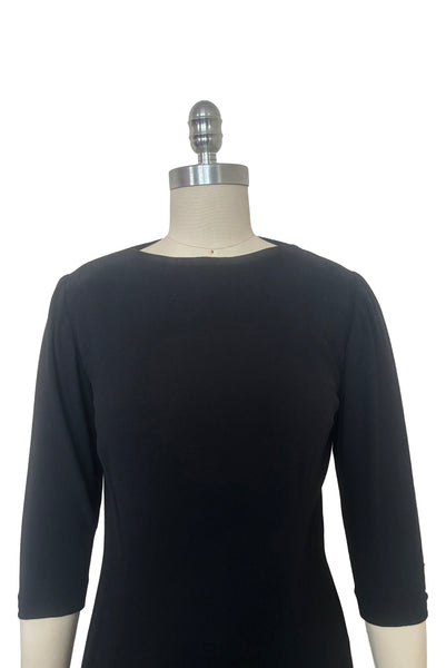 Bodice front view of 1940s vintage black wool crew neck, 3/4 sleeve, drop waist dress with asymmetrical gathered front draped wrap skirt, size extra small to small.